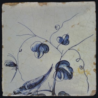 Blue tile with bird sitting on grape leaf tending downwards, dragonfly to tendril, of chimney pilaster with 13 tiles, tree
