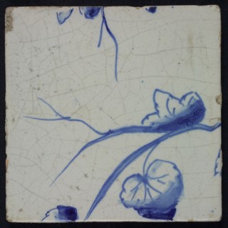 Blue tile with grape leaves and tendrils of pilaster with 39 tiles, tree of bunches of grapes between which birds, insects, tile