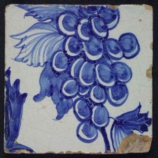 Blue tile with grape leaves, grape bunch and tendrils of pilaster with 39 tiles, tree of bunches of grapes among which birds