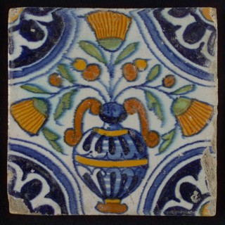 Tile, blue draft, orange, brown, yellow and green on white, central flowerpot with marigolds, corner pattern, rosette, wall tile