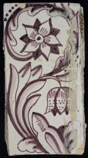 Rectangular edge tile in purple with sling-decoration of speckled tulip, flower with ten triangular petals