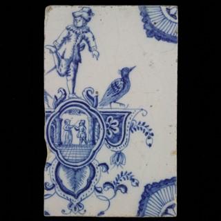 tile manufacturer: Aalmis, Cartouche tile, acrobat with man and woman, corner motif quarter rosette, wall tile tile sculpture