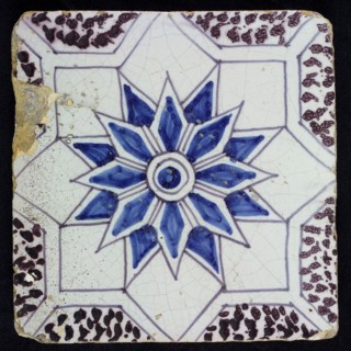 Sprinkled ornament tile, center double circle, double eight-pointed blue star, against background of two white eight-pointed