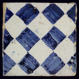 Ornament tile, checkerplate motif, small windows, floor tile tile sculpture ceramic earthenware glaze, Blue on white with dark