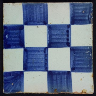 Ornament tile, checkerplate motif, small windows, floor tile tile sculpture ceramic earthenware glaze, Blue on white with dark
