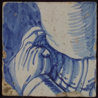 Tile with blue drawing (part of body with arm?), tile picture footage fragment ceramics pottery glaze, d 1.1