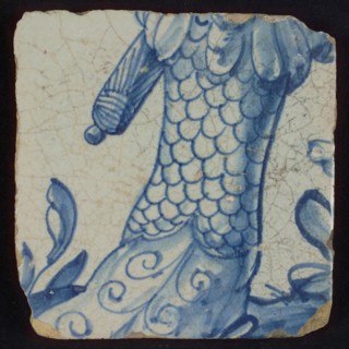 Tile with leg in blue armored with foot, tile picture footage fragment ceramics pottery glaze, d 1.1