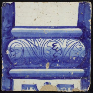 Tile of chimney pilaster, blue on white, bottom of column with basement with curly floral decoration, division with dots