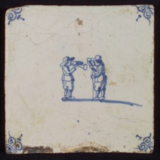 Scene tile, child's play, trumpet and horn playing, corner motif ox's head, wall tile tile sculpture ceramic earthenware enamel