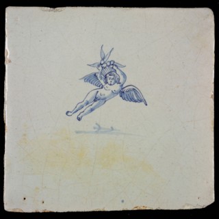 White tile with blue flying putto, wall tile tile sculpture ceramic earthenware glaze, baked 2x glazed painted