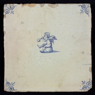 White tile with blue seated putto; corner pattern ox head, wall tile tile sculpture ceramic earthenware glaze, baked 2x glazed