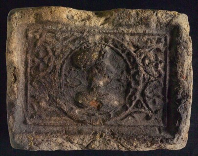 Hearthstone, Luiks, from Luik, Liege Belgium, with wide frame, with male head, natural stone fireplace component ceramic brick