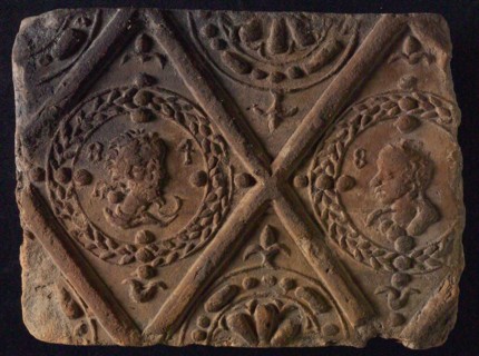 Hearthstone, from Antwerp Belgium, without frame, with male and female head, hearth fireplace component ceramics brick, flamed