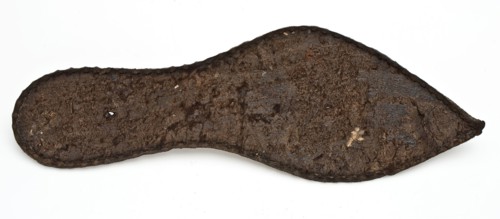 Shoe fragment, consisting of pointy sole of the left shoe, rather small size, sole shoe footwear clothing part soil finding