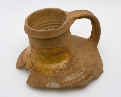 Neck of pottery jug from Andenne, yellow shard, lead glaze on the shoulder, kitchen utensils fragment soil found ceramic