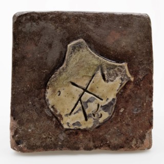 Tile, brown glazed with yellow shield with mark, tiling floor tile tile footage soil find ceramic earthenware glaze lead glaze