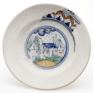 Completed majolica sign with polychrome landscape with buildings and trees, plate crockery holder soil find ceramic earthenware