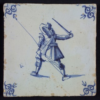 White tile with blue warrior with plume hat, spear and raised sword, seen from behind; corner pattern ox head, wall tile