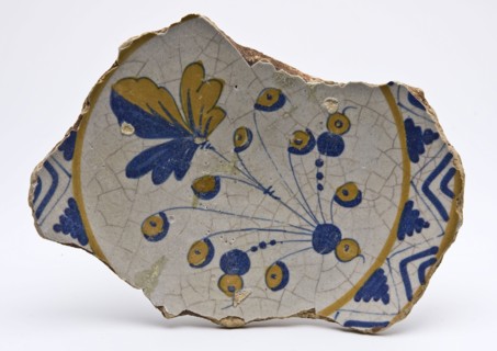 Fragment majolica dish with leaf figure in orange and blue, dish plate crockery holder soil find ceramic earthenware glaze tin