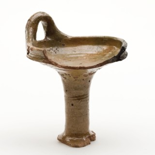 Fragment of red earthenware oil lamp, oil lamp lamp lighting agent earth discovery ceramics earthenware glaze lead glaze, hand