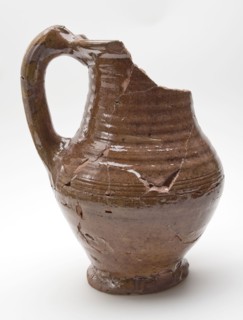 Pottery jug, completely brown glazed with high band ear, on stand, water jug crockery holder soil find ceramic earthenware glaze