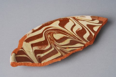 Fragment of earthenware plate with decor in sludge flow technique, plate crockery holder fragment earthenware ceramics