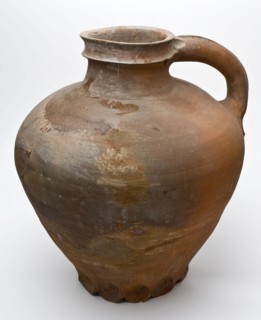 Pottery water jug on circle of stand fins, red shard, some glaze on the shoulder, water jug crockery holder soil find ceramic