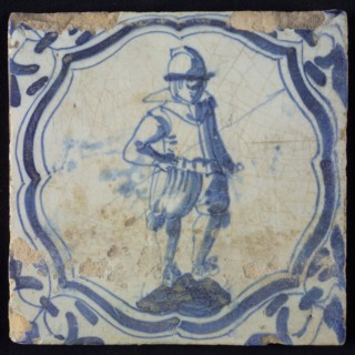 White tile with blue warrior in accolade-shaped frame, corner motif wing leaf, wall tile tile sculpture ceramic earthenware