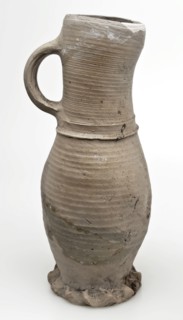 Gray stoneware jug on pinched foot, jug be found at the bottom of the ceramic stoneware, hand-turned baked Stoneware jug flat
