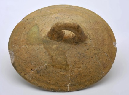 Yellow round lid with ear, pottery, white shard, lid closure soil find ceramic earthenware glaze lead glaze, hand-turned glazed