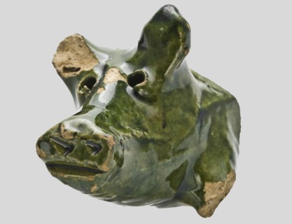 Fragments of pottery piggy banks, two muzzle fragments and one leg, green glazed, piggy bank piggy bank holder fragment