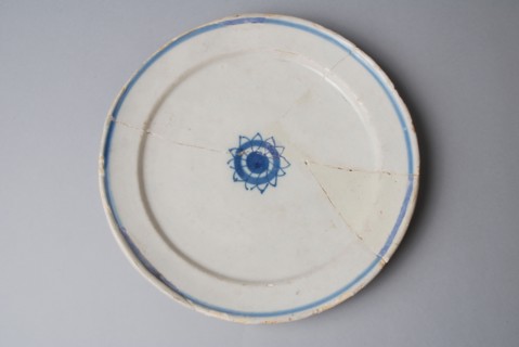 Faience sign on stand, blue decor, small rosette and blue band across flag, plate crockery holder soil find ceramic earthenware