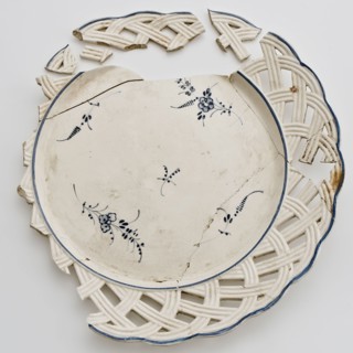 Fragments plate, lace border with wickerwork, blue spreading flowers in the mirror, plate dishware holder earthenware