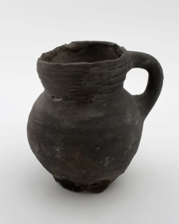 Unglazed jug with ear, rings on straight neck, convex belly on pinched foot, jug crockery holder soil find ceramic pottery, hand