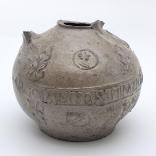 Gray Bartmann jug, also called Bellarmine jug, round middle belly text band, portrait medallions and acanthus leaves, beardmug