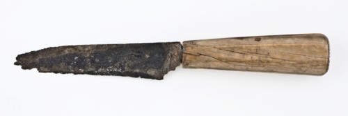 Knife with broad, rather short blade and legs with cut decoration on end, knife cutlery soil find iron bone metal, archeology