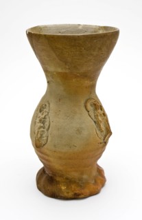 Stoneware drinking cup with funnel neck, decorated with cartouches, on squeeze foot, funnel neck beaker drinkware tableware