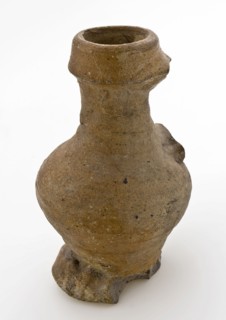 Small stoneware jug with ear, thickened lip, on pinched foot, jug crockery holder soil find ceramic stoneware clay engobe glaze