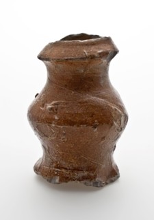 Small stoneware jug with sloping top edge, belly and wide foot, jug crockery holder soil find ceramic stoneware clay engobe