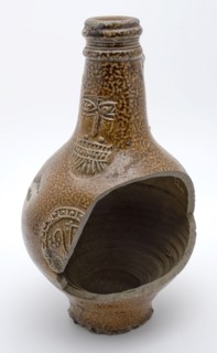 Brown speckled Bartmann jug, also called Bellarmine jug, under beard mask part of medallion, beardmug tableware holder soil find