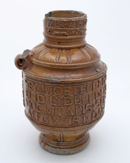 E.M.?, Brown stoneware jug with wide text band around belly and narrow round neck, dated 1568, jug crockery holder soil find