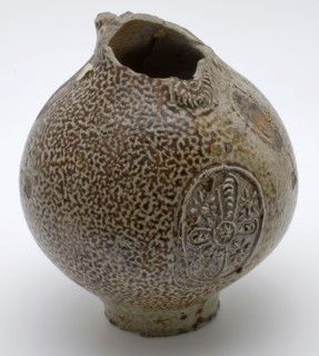 Brown speckled gray Bartmann jug, also called Bellarmine jug, under beard mask medallion with star motif, Bartmann jug jug