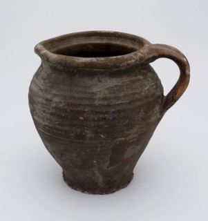 Brown jug with ear and shaving, jug crockery holder soil find ceramic stoneware clay engobe, hand-turned baked Stoneware jug