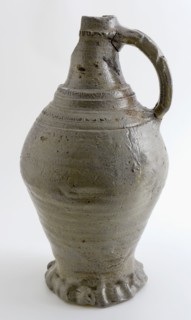 Gray stoneware jug with pinched foot edge, round shoulder profiled bands and rad stamping, jug crockery holder soil find ceramic