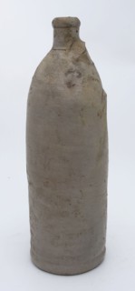 Stoneware mineral water bottle on stand surface, cylindrical, unnoticed, gray, mineral pitcher pitcher pitcher container soil