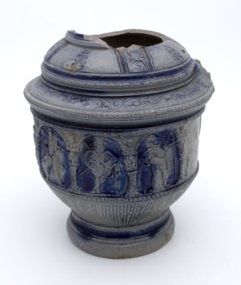 Stoneware jug with arcade around belly including band of musketeers and soldiers, ear with tail, musketeer jar jug crockery