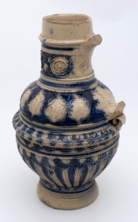 Stoneware jug with round neck appliqués, shoulder with band of plant motifs, cannnelures, dated, jug crockery holder soil find