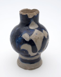 Small stoneware jug with abstract gray ornament on blue fond over neck, shoulder, belly, jug crockery holder model? toy relaxant