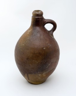 Brown speckled and slightly crooked jar with band ear and short tail, jug crockery holder soil find ceramic stoneware glaze salt