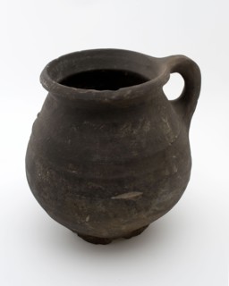 Dark-gray earthenware jug be used with coarse, twisted ears on six fins at the top, casserole can be found in the earthenware